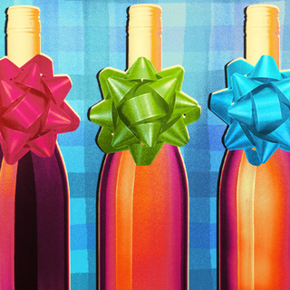 Three unlabeled orange-hued wine bottles stand side by side, each with a gift bow around the neck. The background is blue gingham.