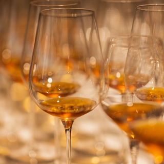 Glasses of sweet wine with a honey-like hue.