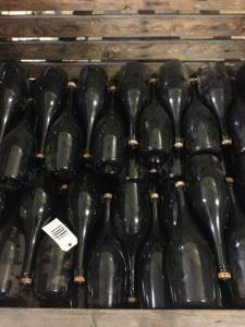 Cremant bottles awaiting labeling